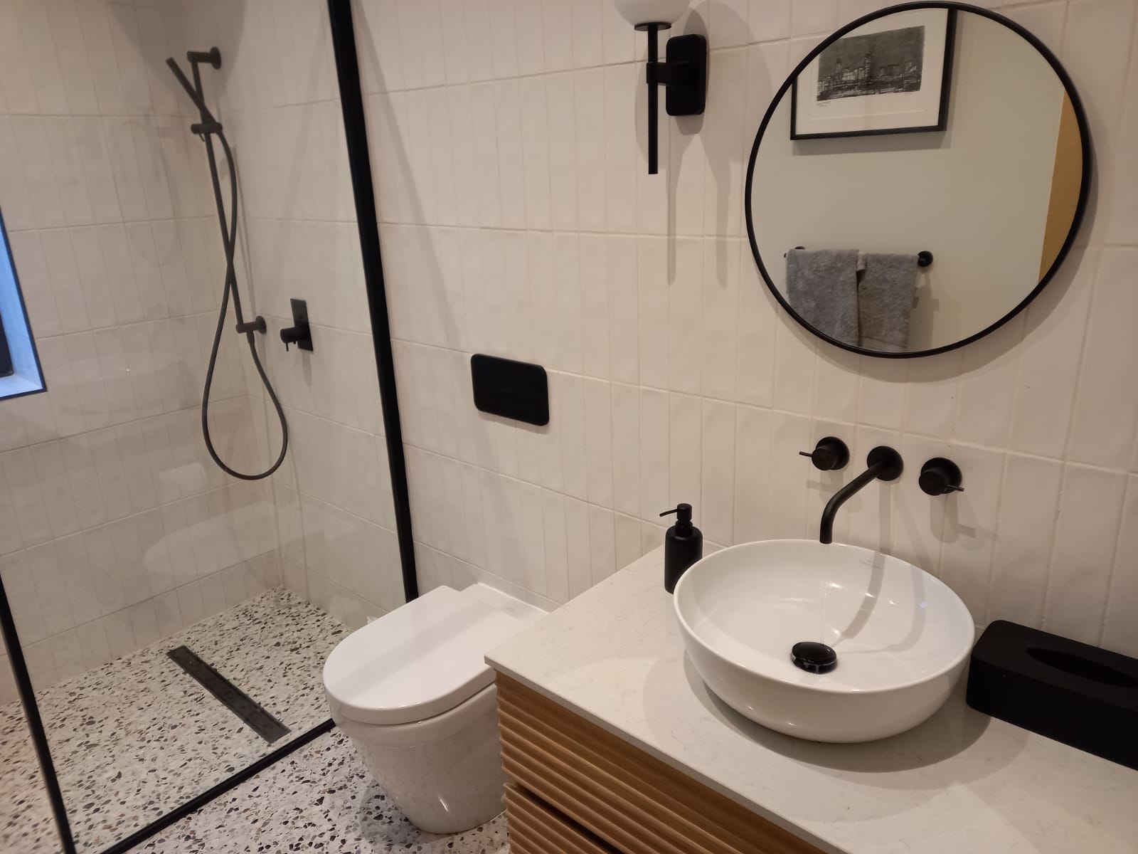 Bathroom installation with clean plumbing finishes